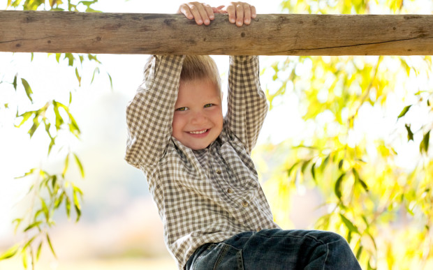 Boy on a fence.